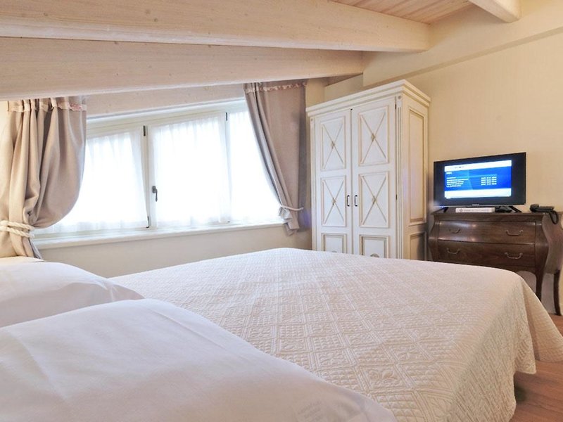 Ferien im Chervo Golf Hotel Spa & Resort San Vigilio - Apartments - hier günstig online buchen